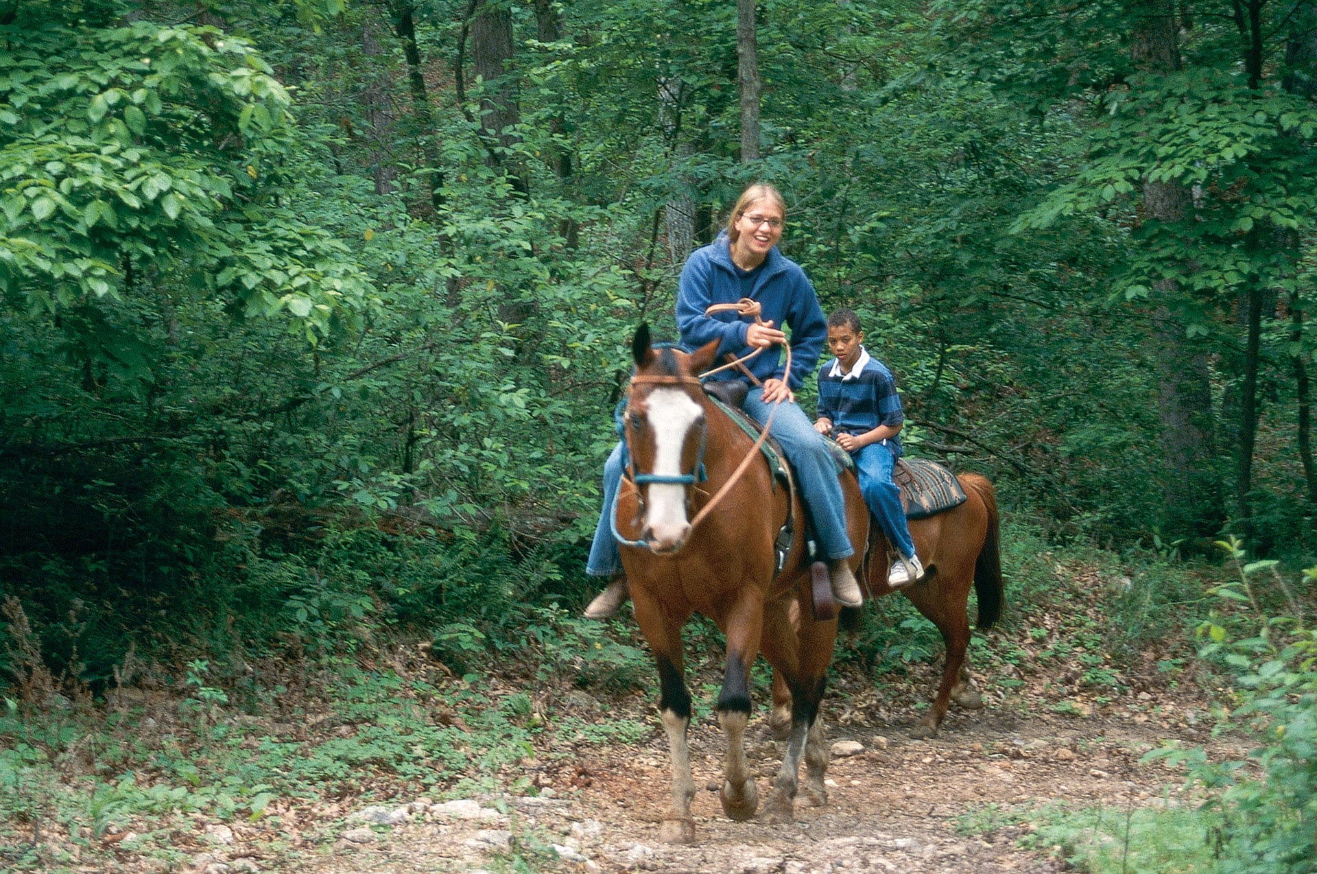 Two horse riders on an equestrian trail at Lake of the Ozarks State Park
